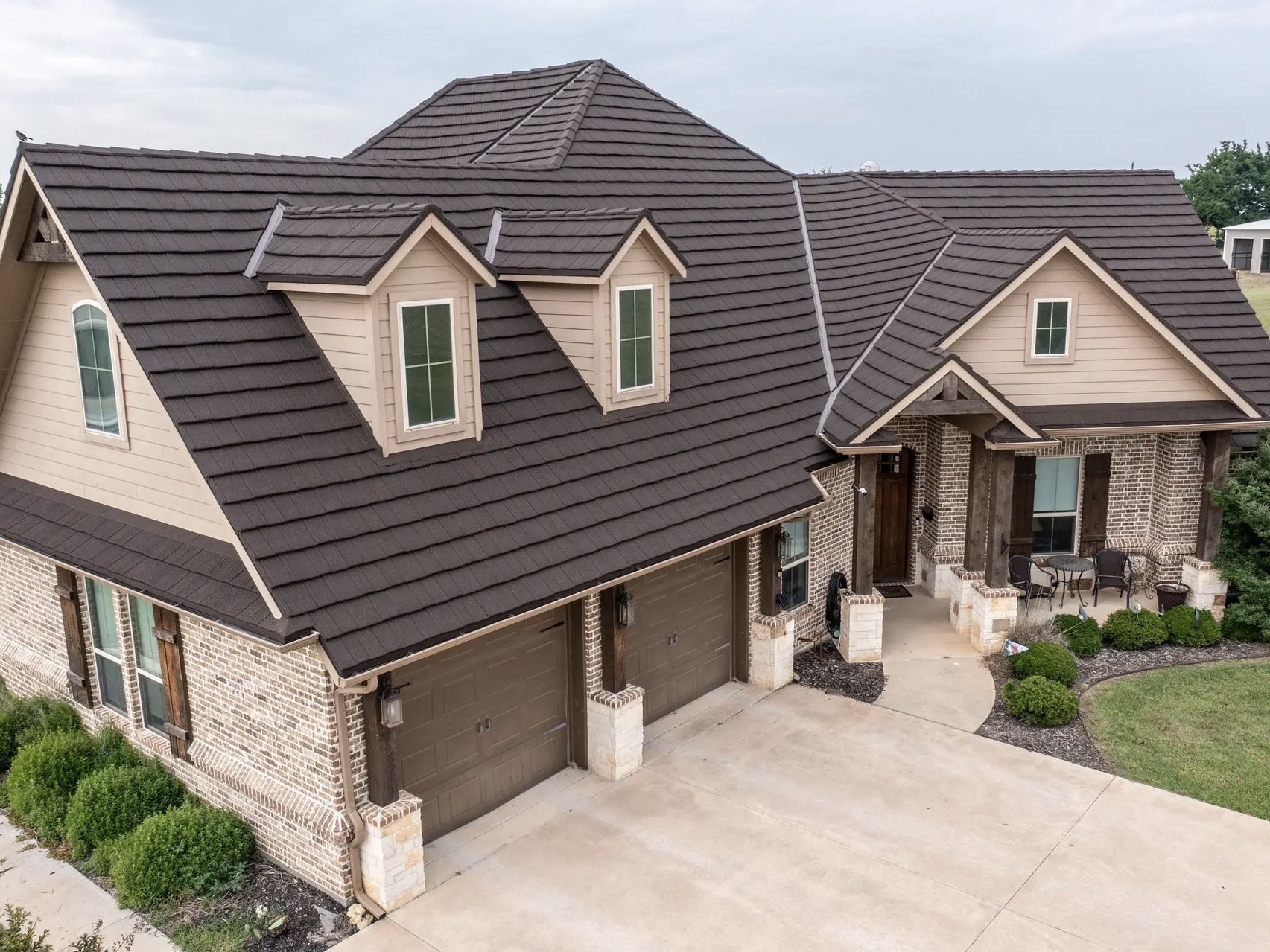 house with white and grey tan exterior painting